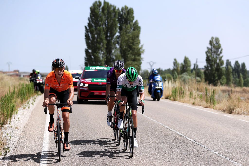 BURGOS SPAIN AUGUST 15 LR Xavier Mikel Azparren Irurzun of Spain and Team Euskaltel Euskadi Diego Rubio Hernandez of Spain and Team Burgos BH and Sergio Roman Martin Galan of Spain and Team Caja RuralSeguros RGA in the Breakaway during the 76th Tour of Spain 2021 Stage 2 a 1667km stage from Caleruega Monasterio de Santo Domingo de Guzmn to Burgos Gamonal lavuelta LaVuelta21 CapitalMundialdelCiclismo on August 15 2021 in Burgos Spain Photo by Gonzalo Arroyo MorenoGetty Images