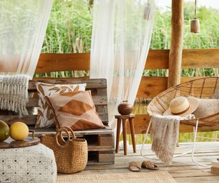 Wicker chair and cushions on a styled terrace