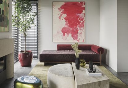 gray living room with red sofa