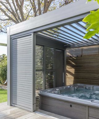 hot tub in modern enclosed pergola from garden house design