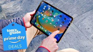 iPad 10th gen being used over a sidewalk with a prime day deal tag