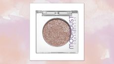 Image of Urban Decay's Moondust Eyeshadow in shade 'Space Cowboy' on a pink watercolour background