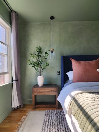 bedroom with green walls and ceiling