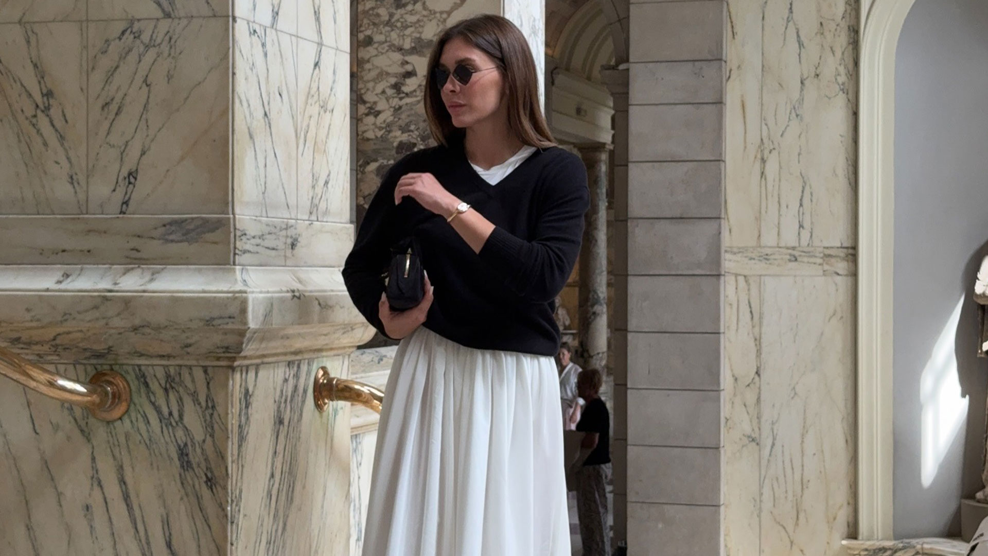 @by_eva_ outfit photo in black v-neck sweater and white midi skirt