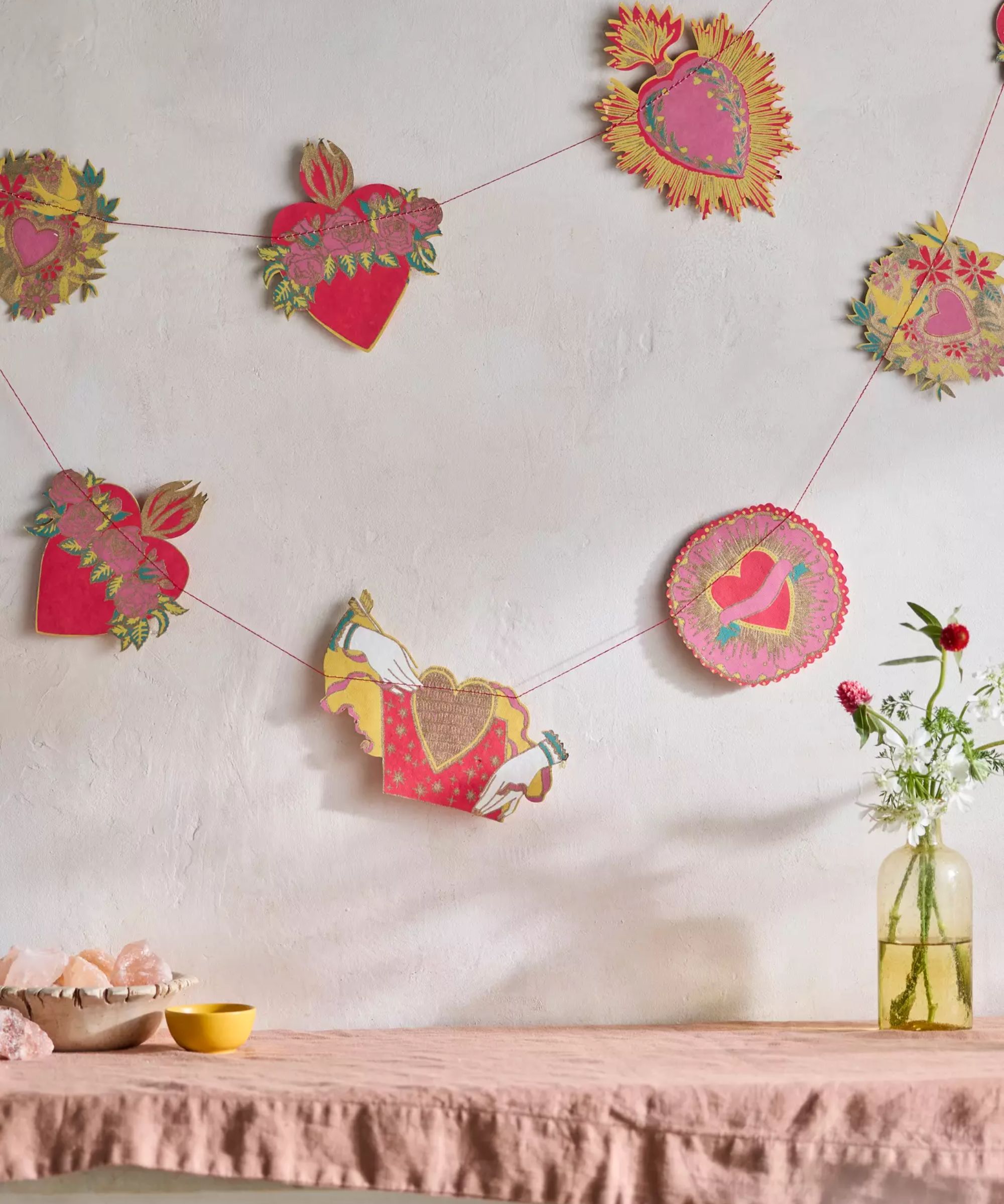 Paper garland with pink hearths and yellow flowers
