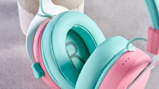 A pink and teal Cooler Master CH351 wireless gaming headset