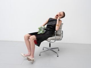Woman in Hermes sitting on office chair