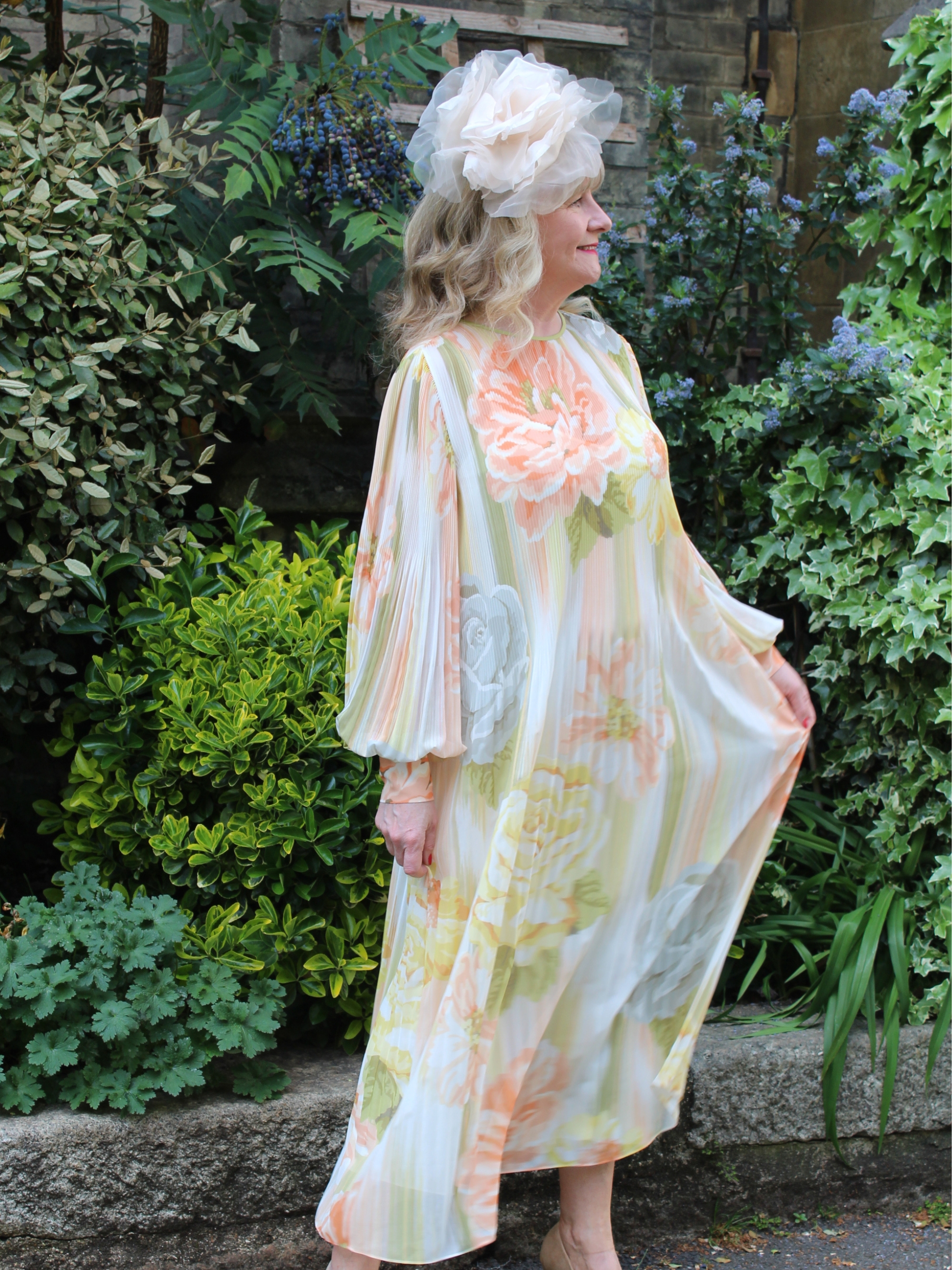 Julie Player wearing Florere, Floral Print Pleated Midi Dress
