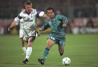 Sergi Barjuan (right) of Barcelona is pursued by Stefan Schwarz of Fiorentina during the European Cup Winners Cup Semi-Final second leg at the Stadio Comunale in Florence, Italy. Barcelona won 2-0 on the night and 3-1 on aggregate.