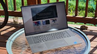 The Dell XPS 17 9720 laptop on a table outside