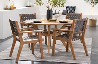 A wooden outdoor dining set