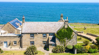 Period stone house looking onto the sea