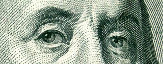 Closeup of Ben Franklin's eyes on the 100 dollar bill. Credit: sxc.hu | gravityx9
