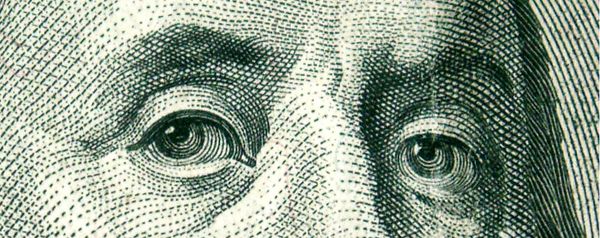 Closeup of Ben Franklin&#039;s eyes on the 100 dollar bill. Credit: sxc.hu | gravityx9