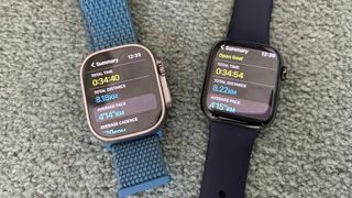 Apple Watch Ultra next to Apple Watch Series 8, both displaying post-run screens, the Series 8 displaying 14 more seconds and an extra 0.04km distance