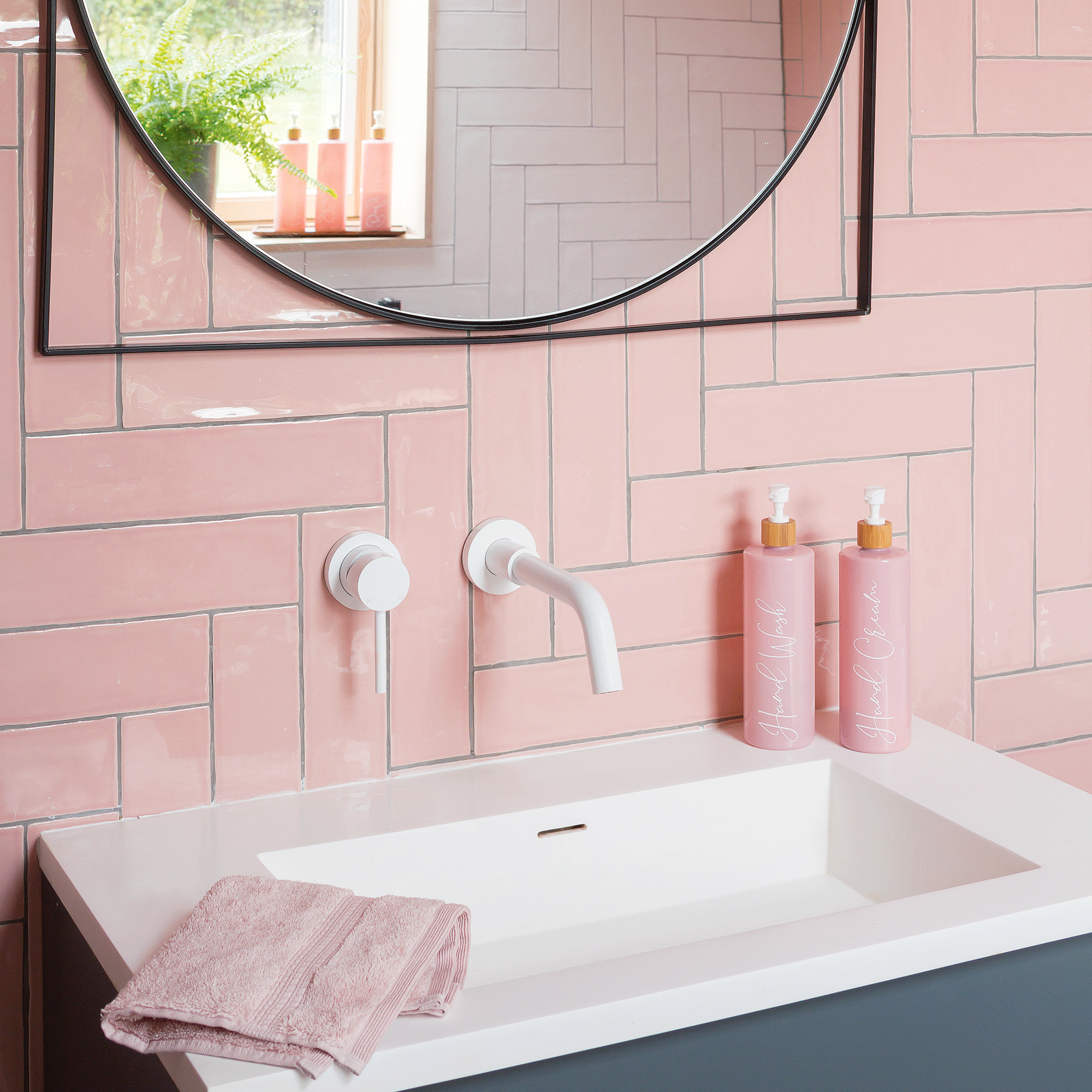 Pink bathroom tiles with sink