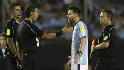 Lionel Messi; Argentina; argues with referee 