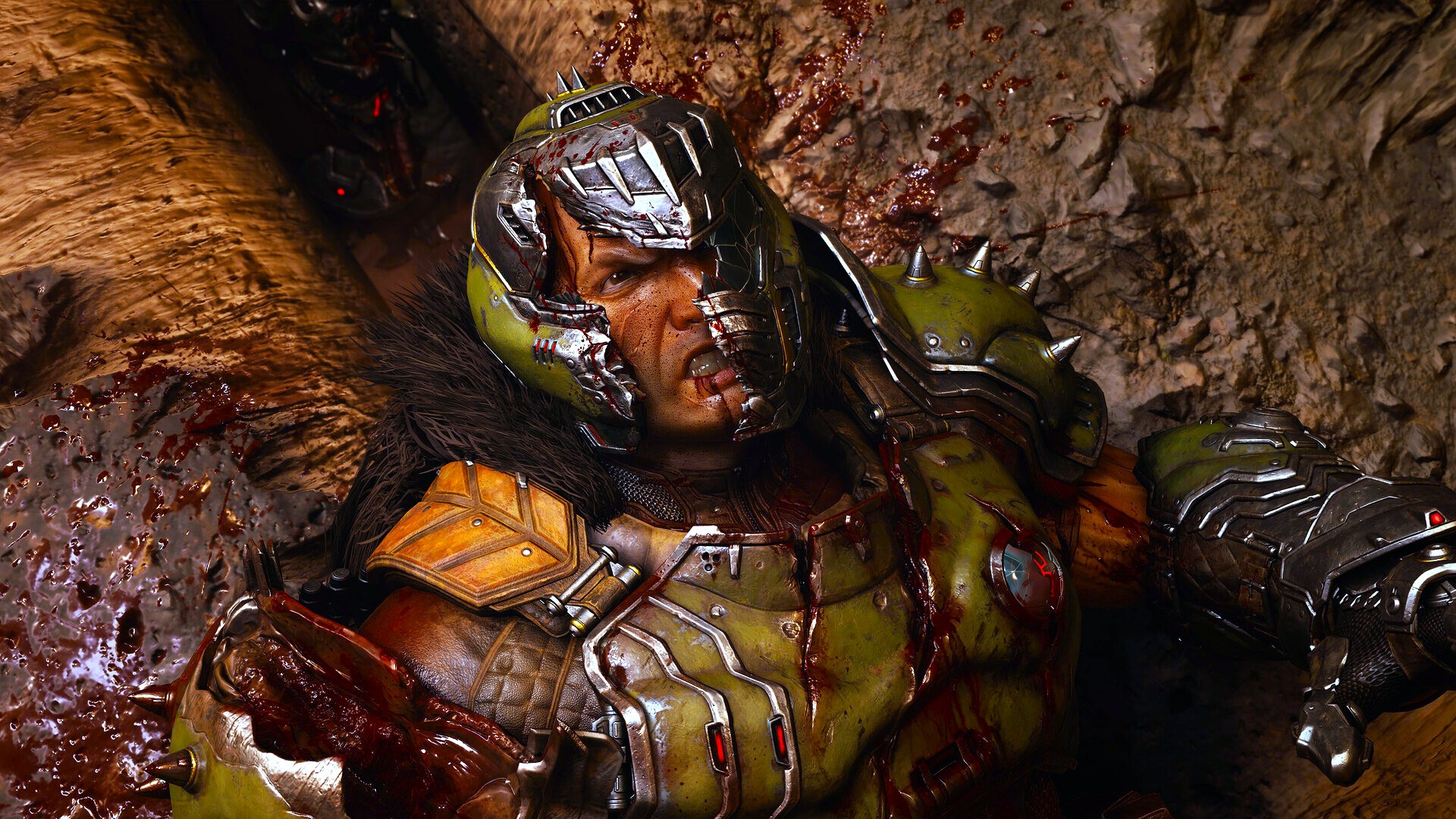 A warrior in a battle-scarred helmet and green armor lies on a gritty surface, covered in blood. His expression is defiant, with a futuristic and intense atmosphere.