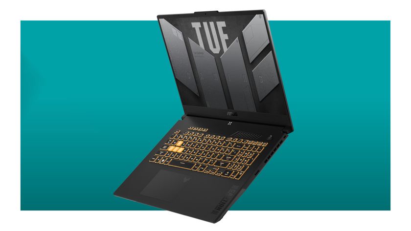 A promotional image of an Asus TUF Gaming F17 laptop against a teal background with a white border