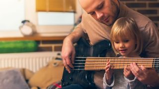 Father plays bass with daughter 