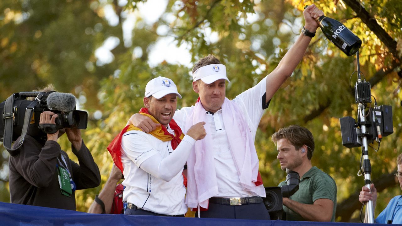 Ian Poulter and Sergio Garcia celebrate after winning the 2012 Ryder Cup at Medinah