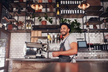 A barista at a coffee shop. 