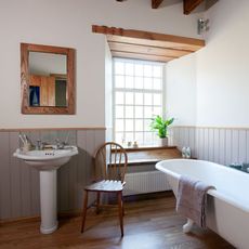 bathroom with bathtub and French window 