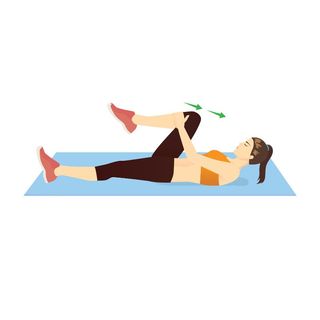 Woman bringing knee to chest in stretch to loosen stiff joints in hip and lower back