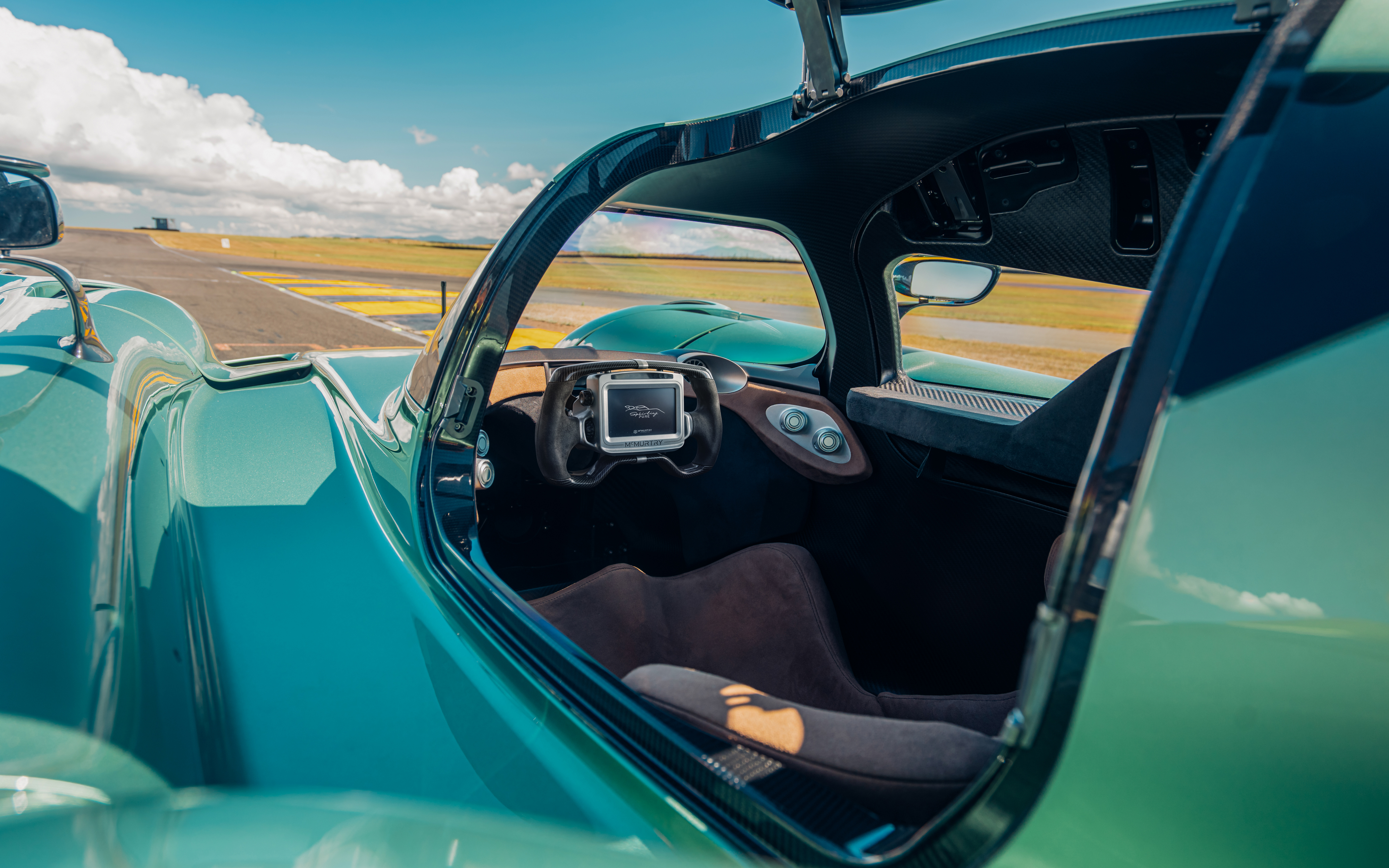 Details of the McMurtry Speirling. It looks like a miniature batmobile in blue