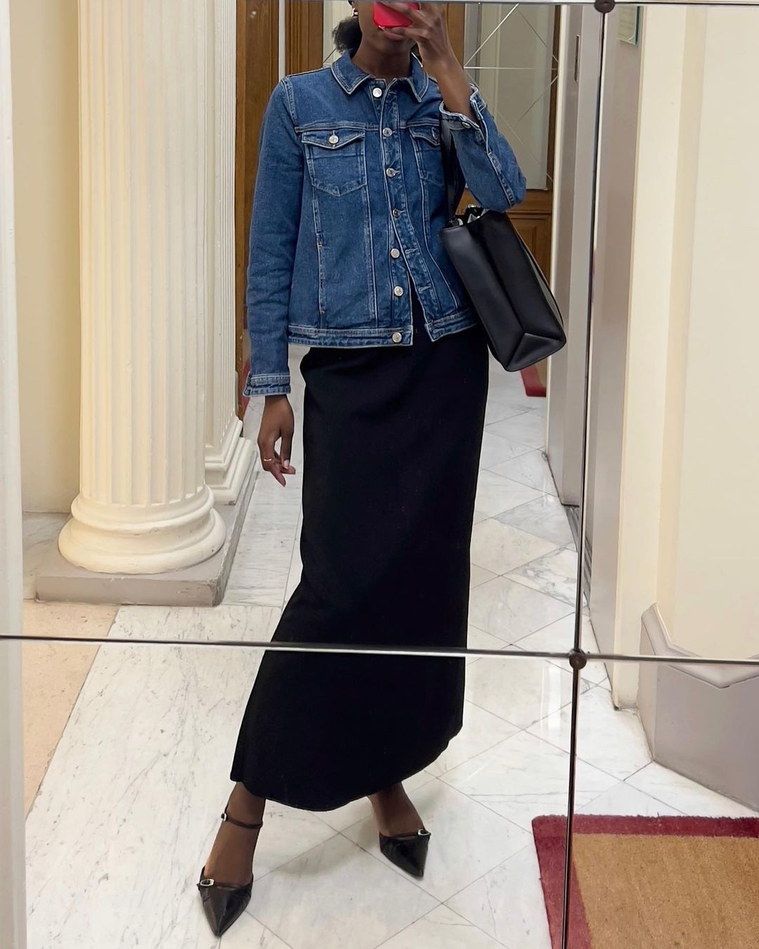 @sylviemus_ wearing a column skirt and denim jacket