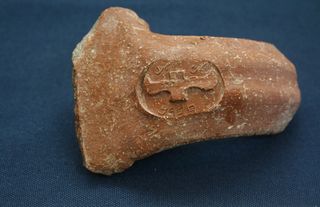 A stamped pottery handle from the Israel settlement called Ramat Rahel. The magnetic minerals used in the pottery were sealed in during heating and are revealing the history of Earth's magnetic field.