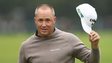 Alex Noren tips his cap to the crowd after winning the BMW PGA Championship