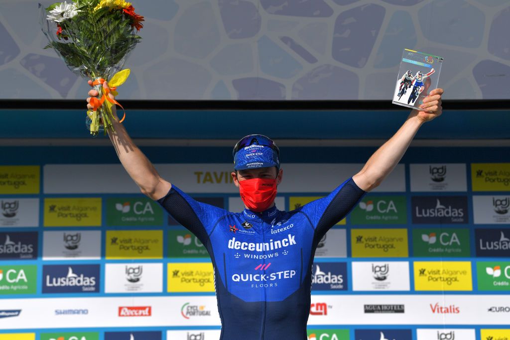 TAVIRA PORTUGAL MAY 07 Sam Bennett of Ireland and Team Deceuninck QuickStep celebrates at podium during the 47th Volta Ao Algarve 2021 Stage 3 a 2031km stage from Faro to Tavira VoltAlgarve Flowers Trophy Mask Covid Safety Measures VAlgarve2021 on May 07 2021 in Tavira Portugal Photo by Luc ClaessenGetty Images