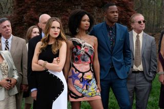 the cast of dynasty wears formal clothes and stands outside in the dynasty reboot