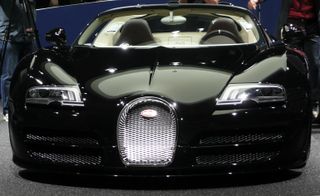 Bugatti Veyron black sports car in ramp