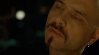 A close up of Joe Pantoliano with facial hair in The Matrix