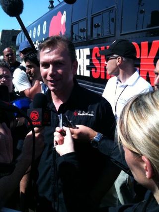 Johan Bruyneel speaks to media outside the RadioShack bus