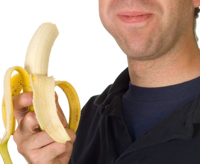 man eating banana