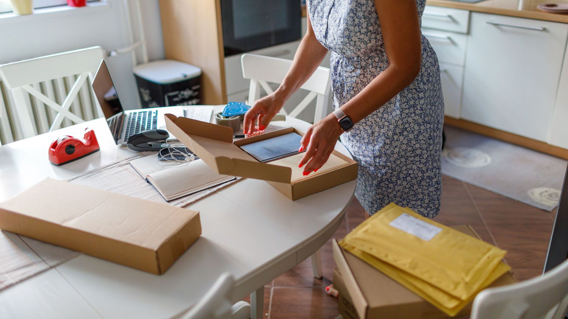 woman packing up books to sell