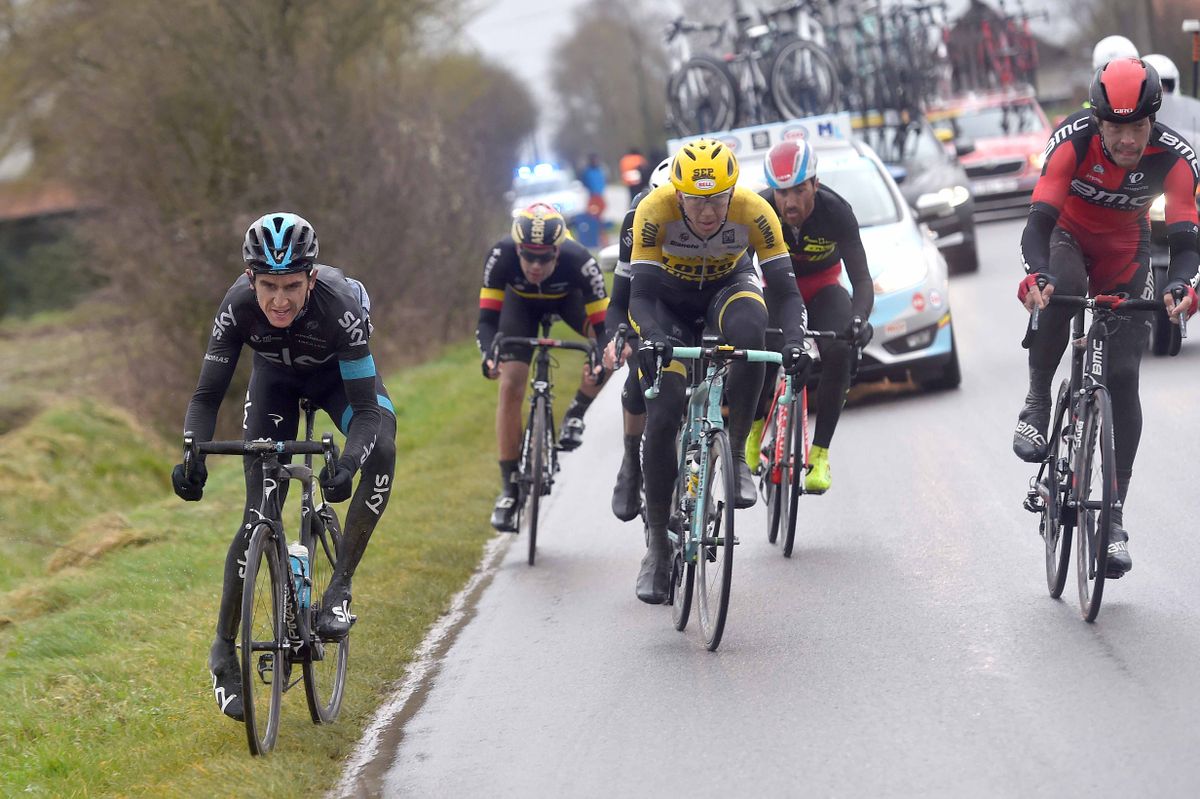 Geraint Thomas (Team Sky) tries to get to his foot out before hitting the deck