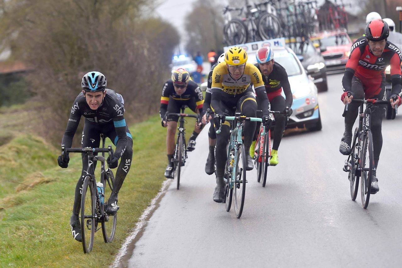 Geraint Thomas (Team Sky) tries to get to his foot out before hitting the deck