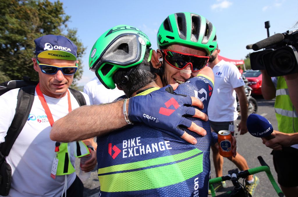 Simon Yates and Orica-BikeExchange teammate Esteban Chaves embrace after the win