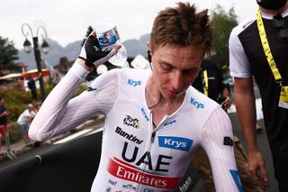 UAE Team Emirates' Slovenian rider Tadej Pogacar wearing the best young rider's white jersey reacts in the finish area after the 16th stage of the 110th edition of the Tour de France cycling race, 22 km individual time trial between Passy and Combloux, in the French Alps, on July 18, 2023. (Photo by Anne-Christine POUJOULAT / POOL / AFP)