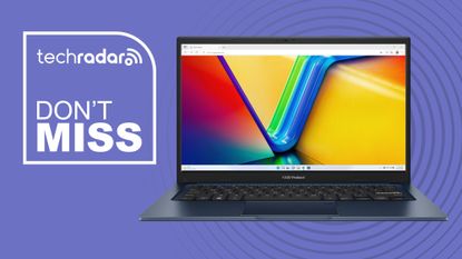 The Asus Vivobook 14 on a blue background with a TechRadar deals badge.
