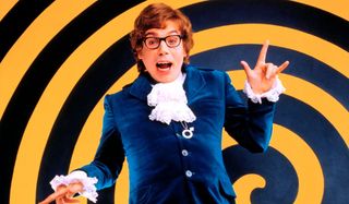 Austin Powers joyfully smiling in front of a spiral