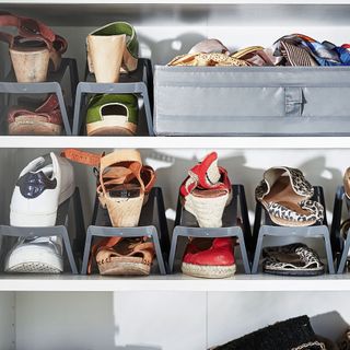 Shoes stored neatly in shoe storage inside wardrobe