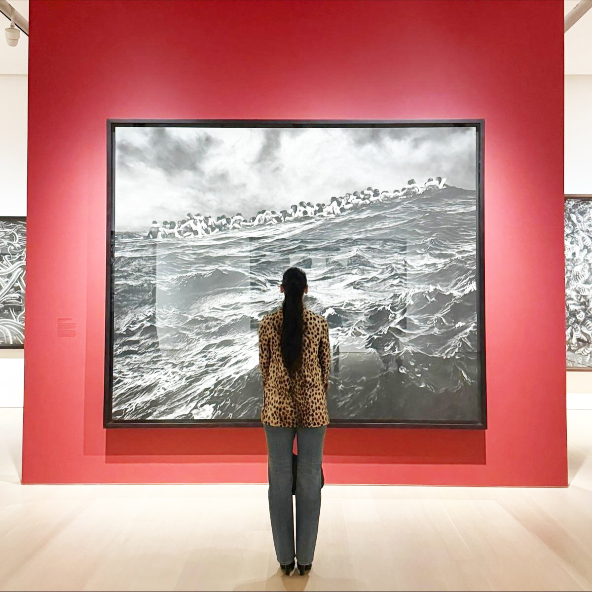 Dua Lipa wearing a leopard-print jacket and jeans