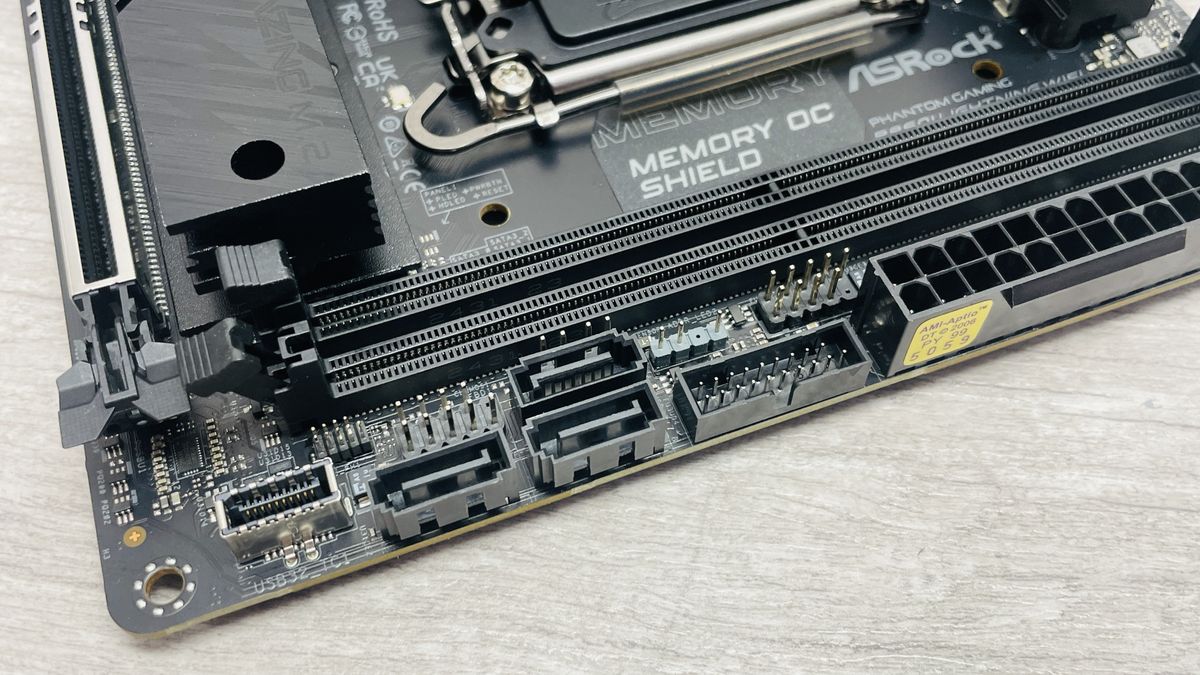 ASRock Phantom Gaming B860I Lightning Wi-Fi motherboard on a desk.