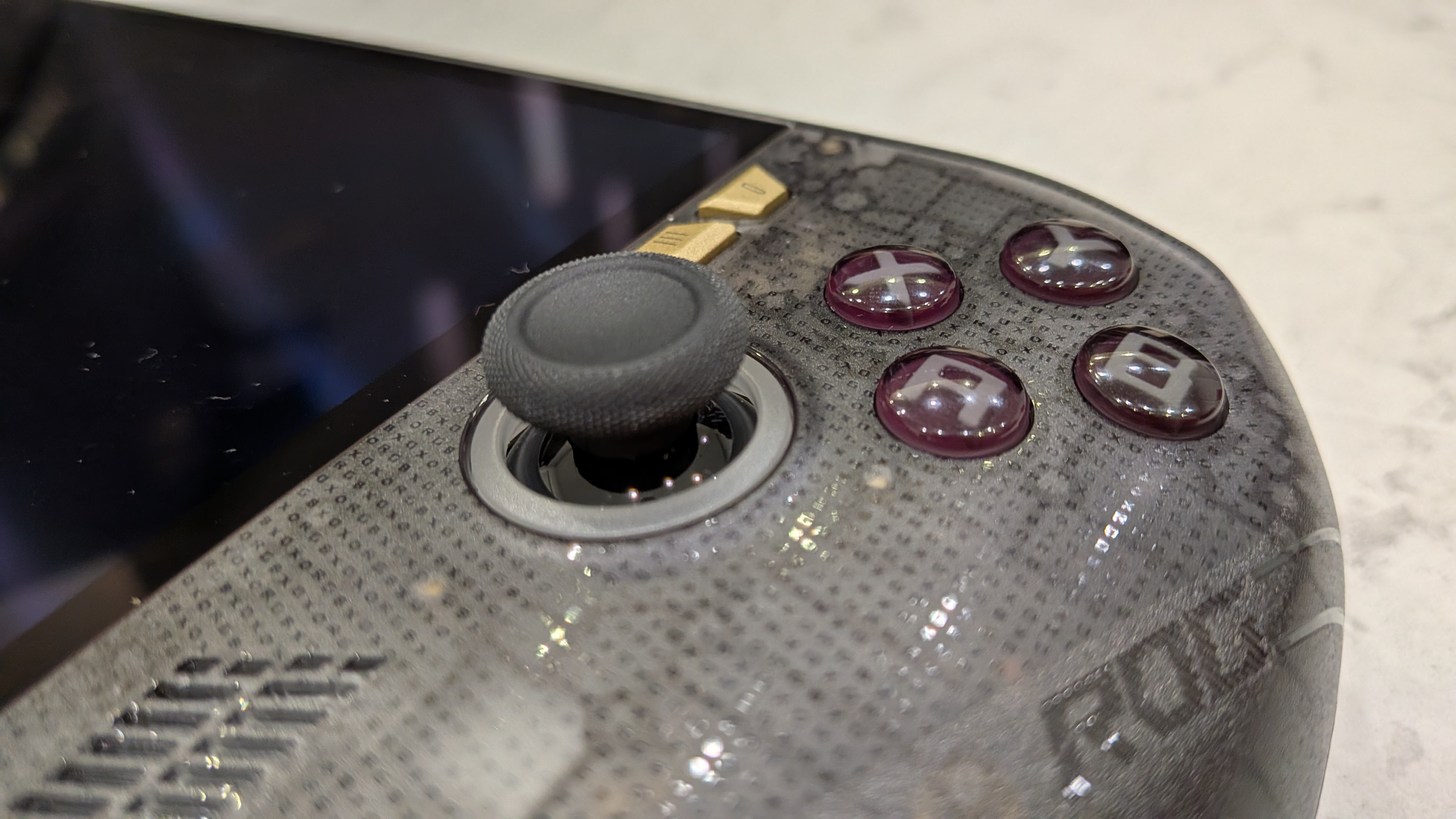 Asus ROG Xbox Ally X20 on a marble counter