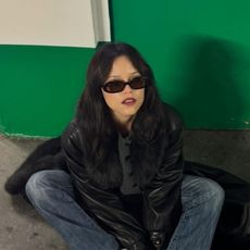 Jenna Ortega wears black Vans sneakers